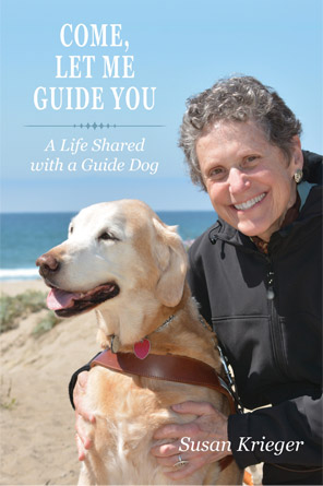 Image of book cover showing author with her guide dog Teela, a beautiful ocean, sandy coastline, and blue sky in the background